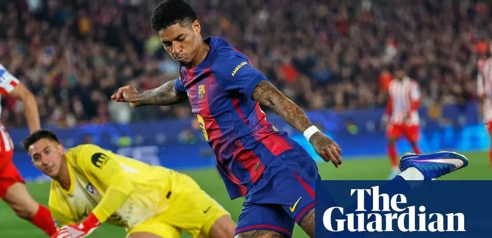 Barcelona player shooting on goal against goalkeeper