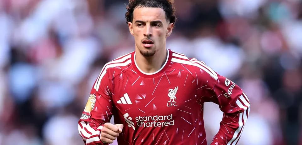 Player in red Liverpool kit during match