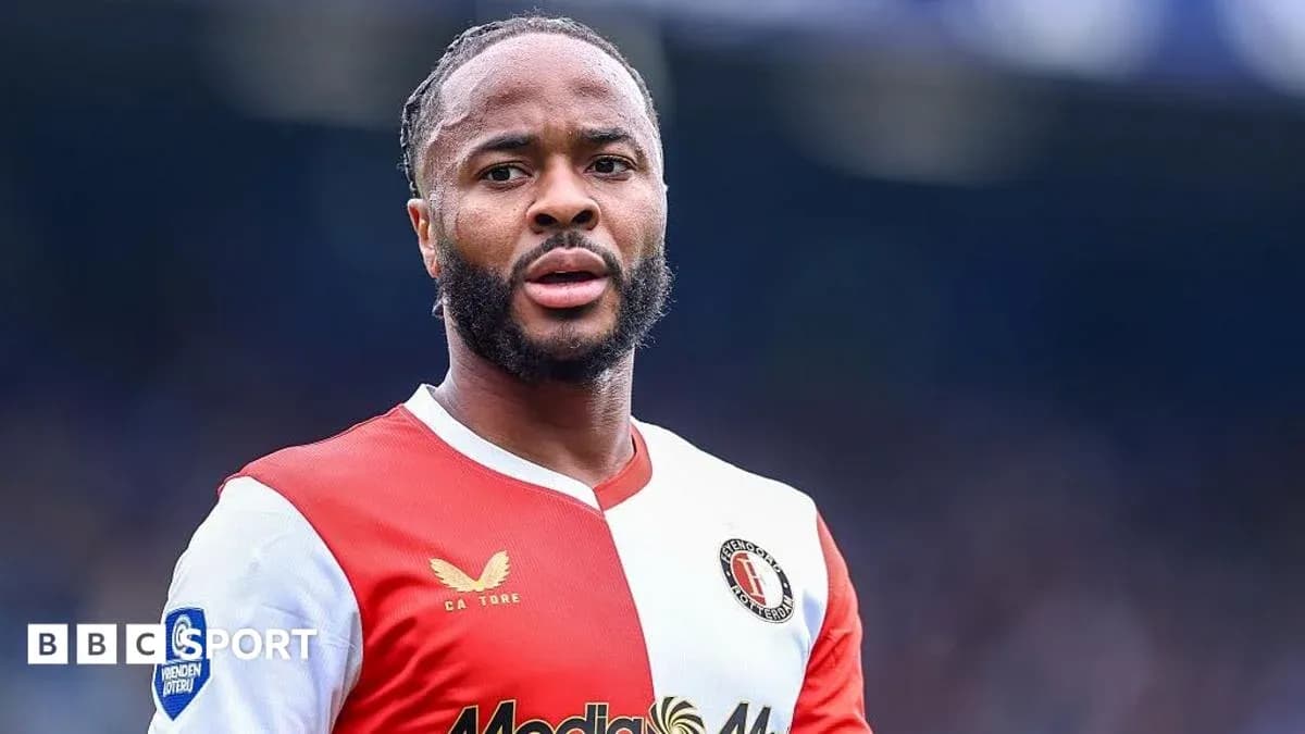 Football player wearing Feyenoord jersey on field