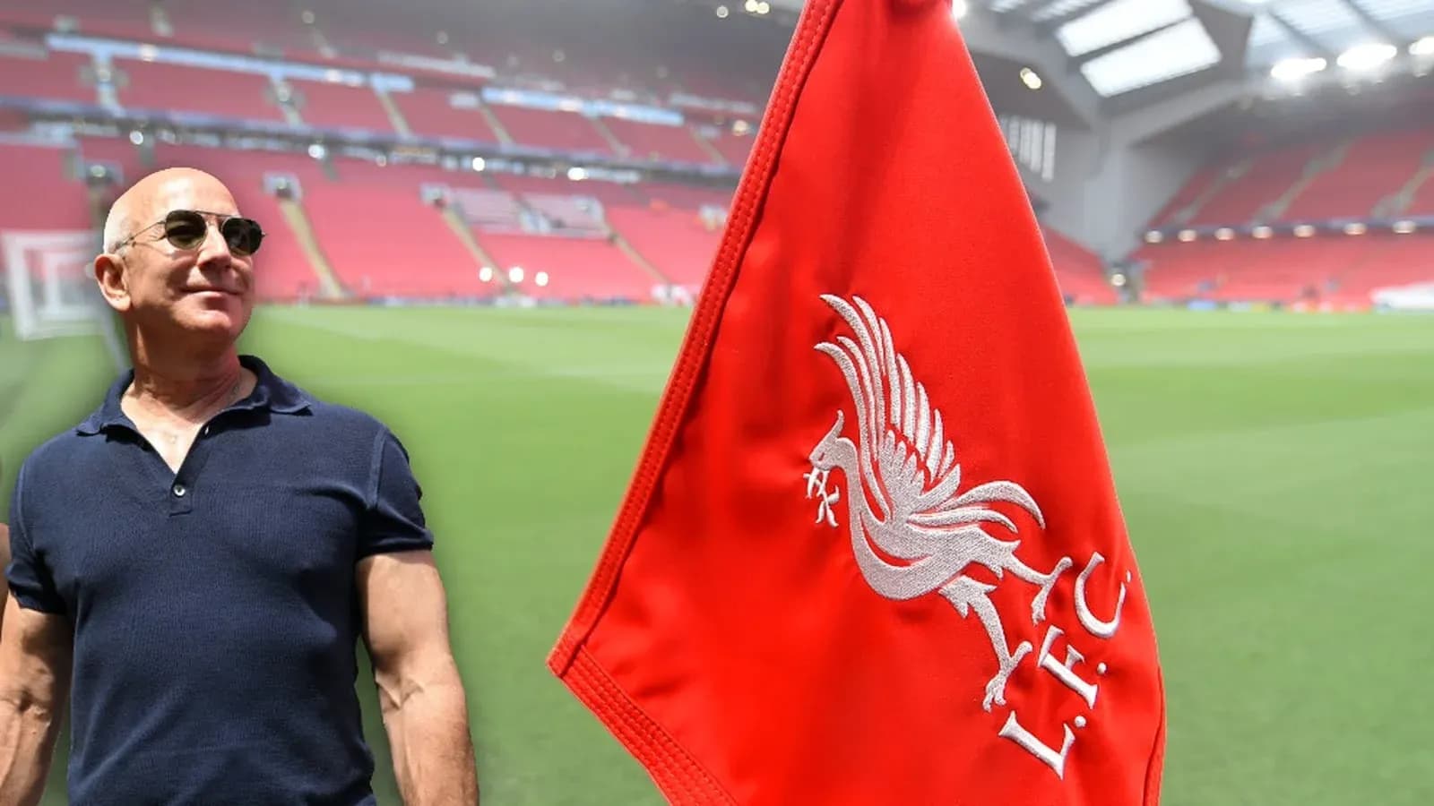 Man beside Liverpool flag at stadium