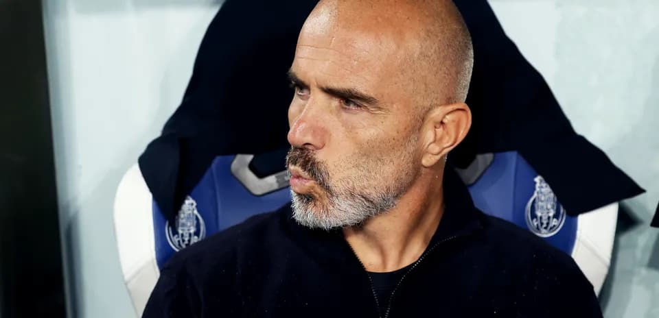 Coach sitting on bench during match observation