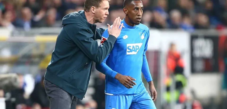 Coach giving instructions to player during match