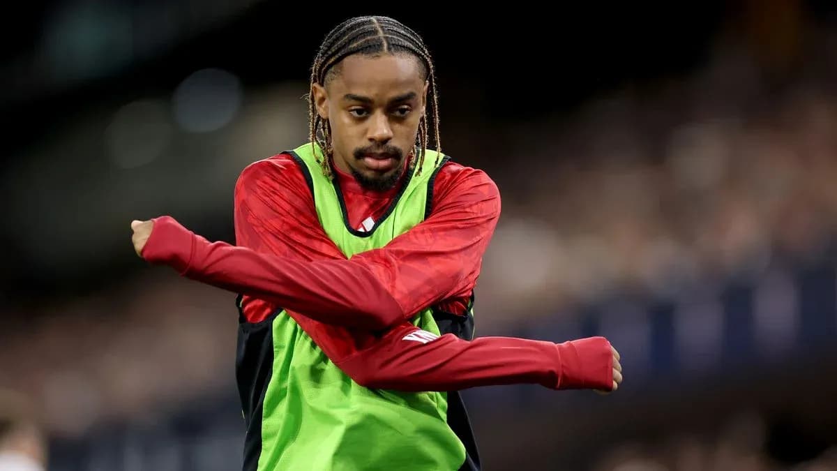 Player stretching on the sidelines during warm-up