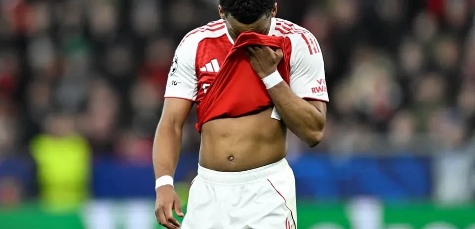 Player holding jersey to face after match