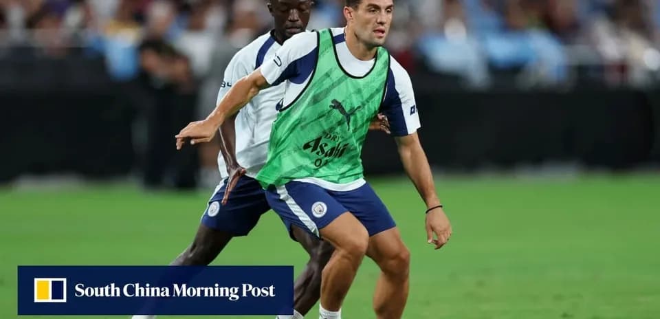 Two players training on the field with a ball