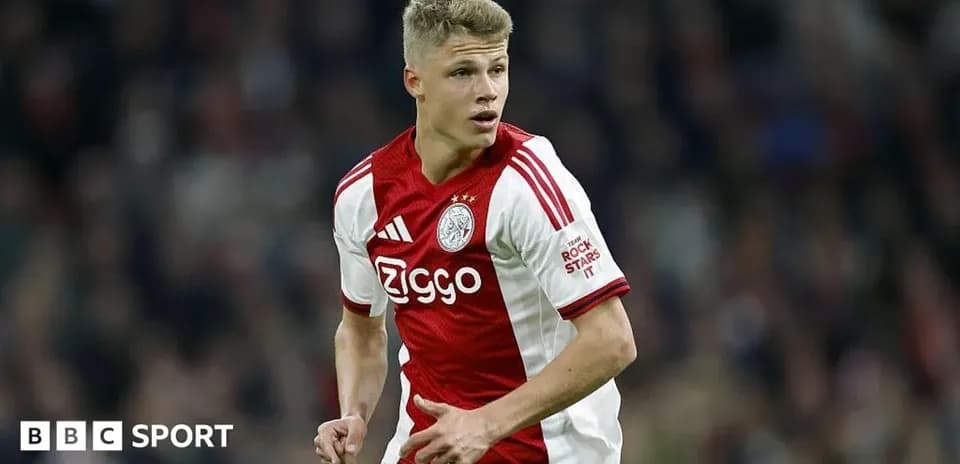 Player in Ajax kit during match action