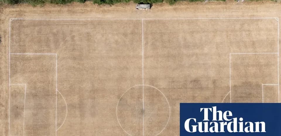 Aerial view of a dry, marked football pitch