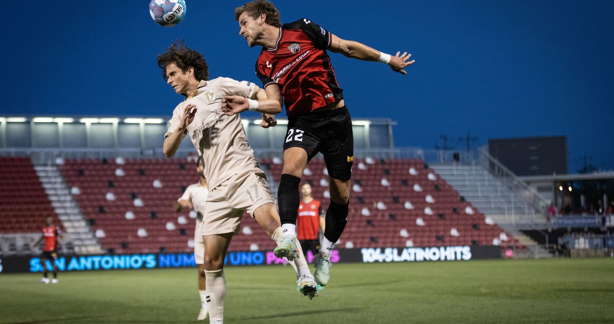 Players contesting for the ball in FC Tulsa match