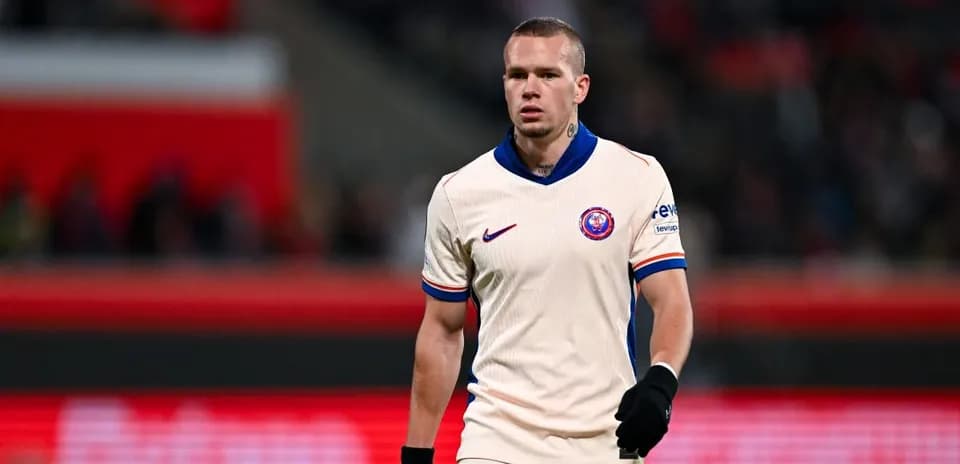 Player walking on the pitch in match attire