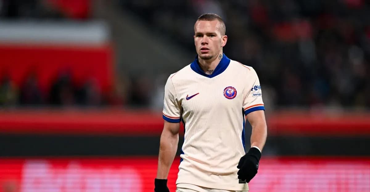 Player walking on the pitch in match attire