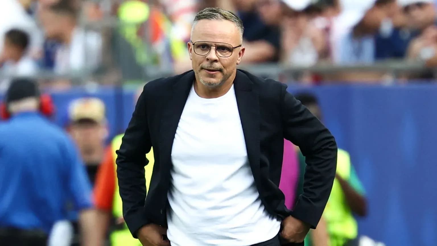 Coach walking on the sideline during match