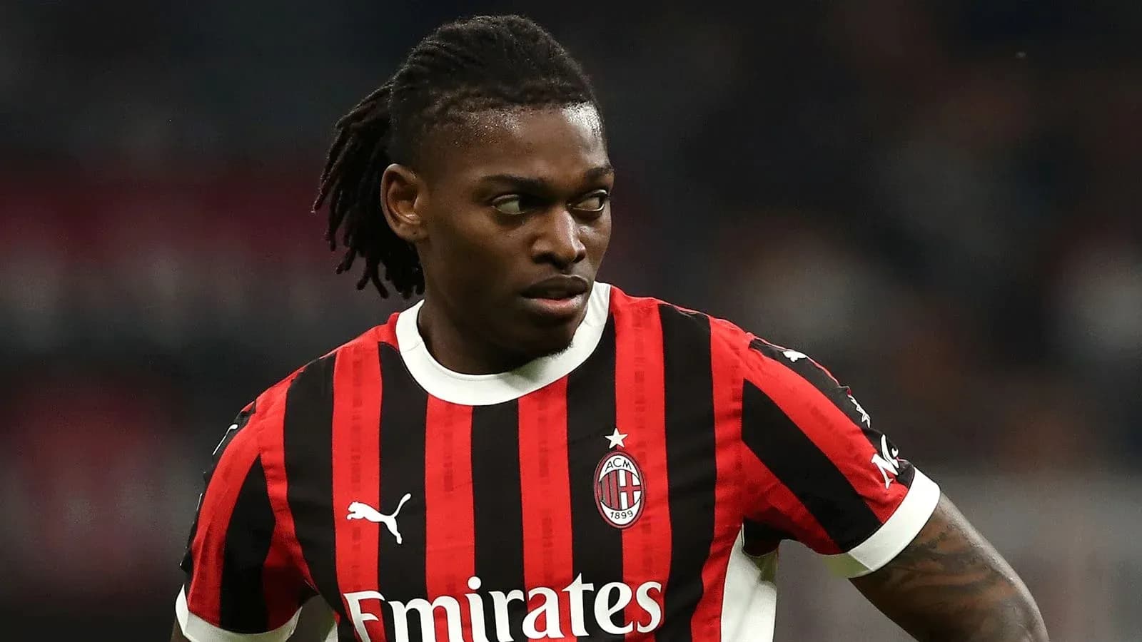 Player in AC Milan jersey during match