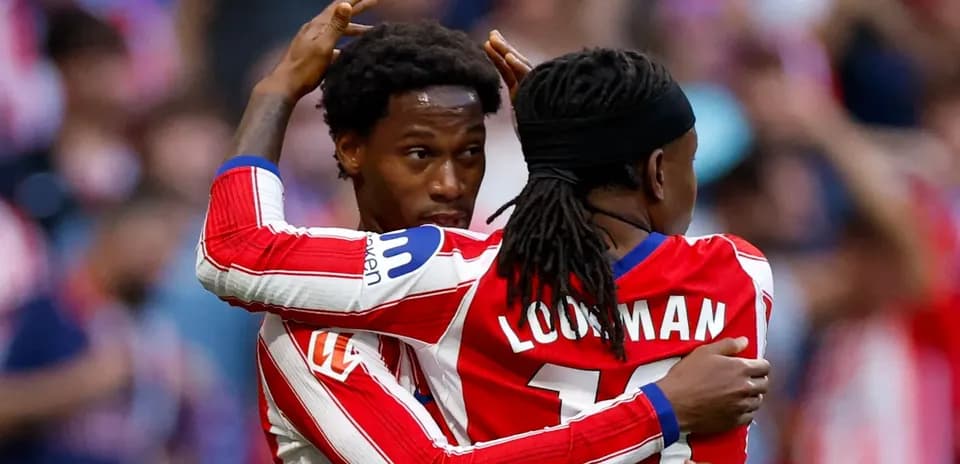 Two players celebrating a goal during match