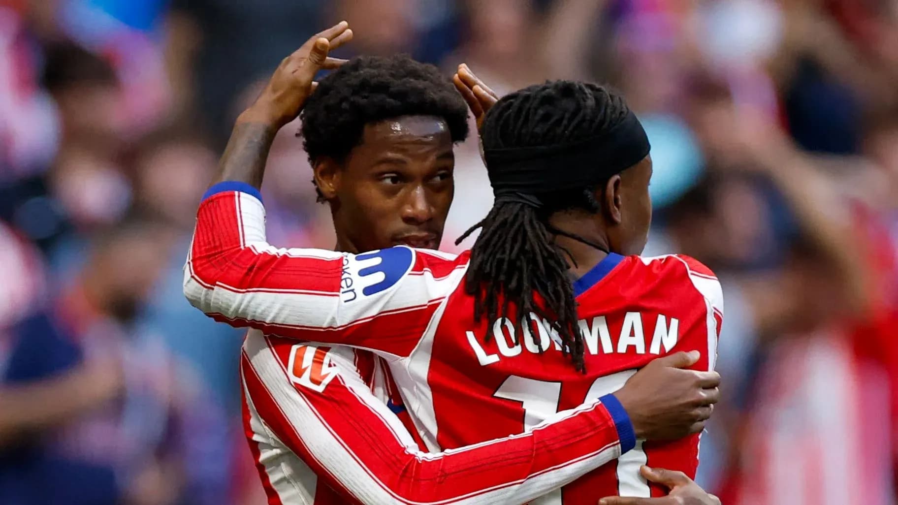 Two players celebrating a goal during match
