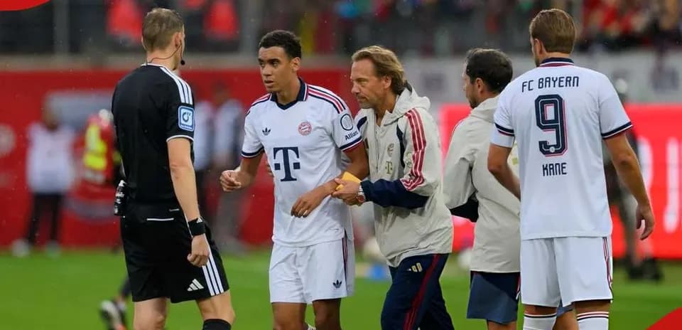 Bayern Munich player interacting with referee and staff