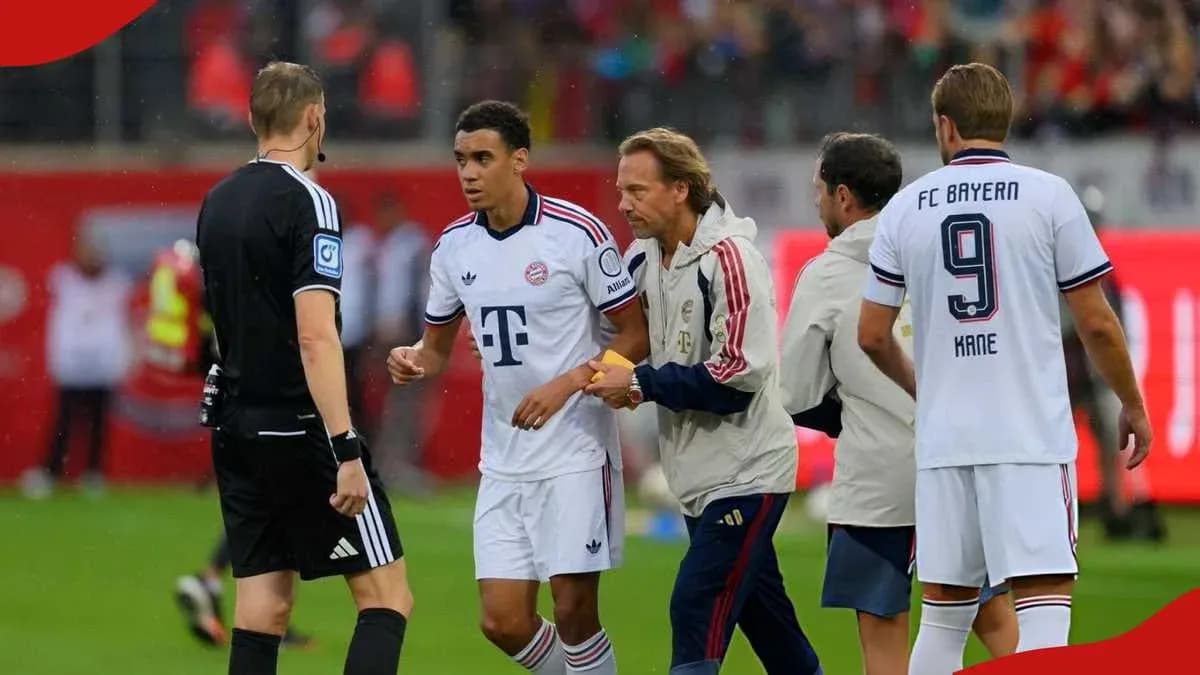 Bayern Munich player interacting with referee and staff