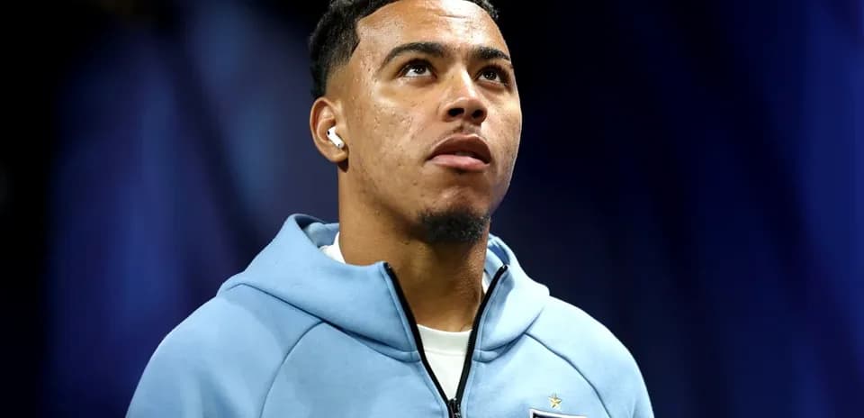 Player wearing England kit during press event