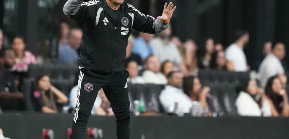 Coach gesturing during a match on the sideline