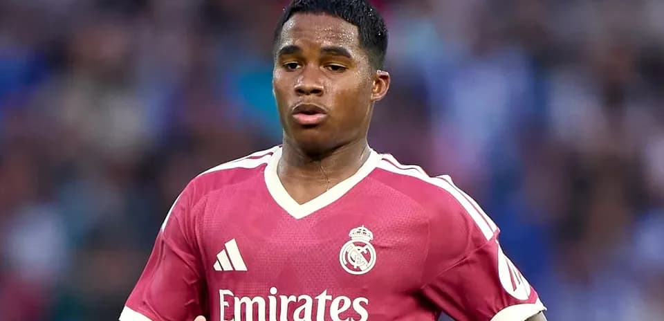 Player wearing pink Real Madrid jersey during match