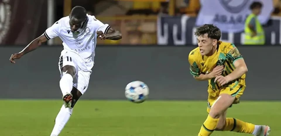 Player shooting the ball during match action