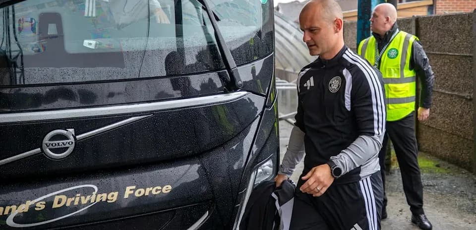 Coach arriving at venue in rainy weather