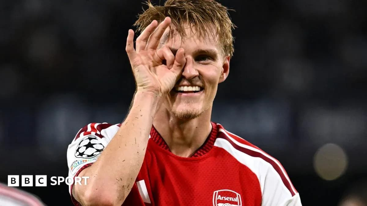 Player celebrating with a hand gesture in jersey