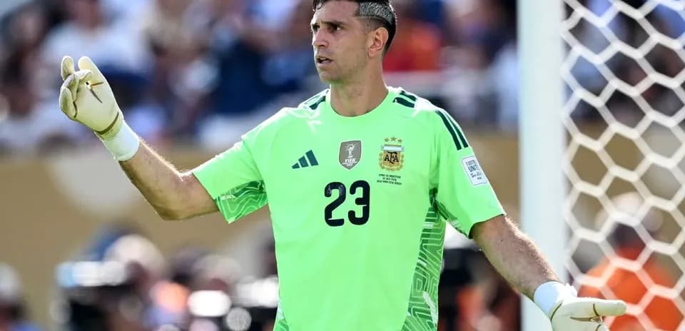 Goalkeeper signaling during a match in green kit