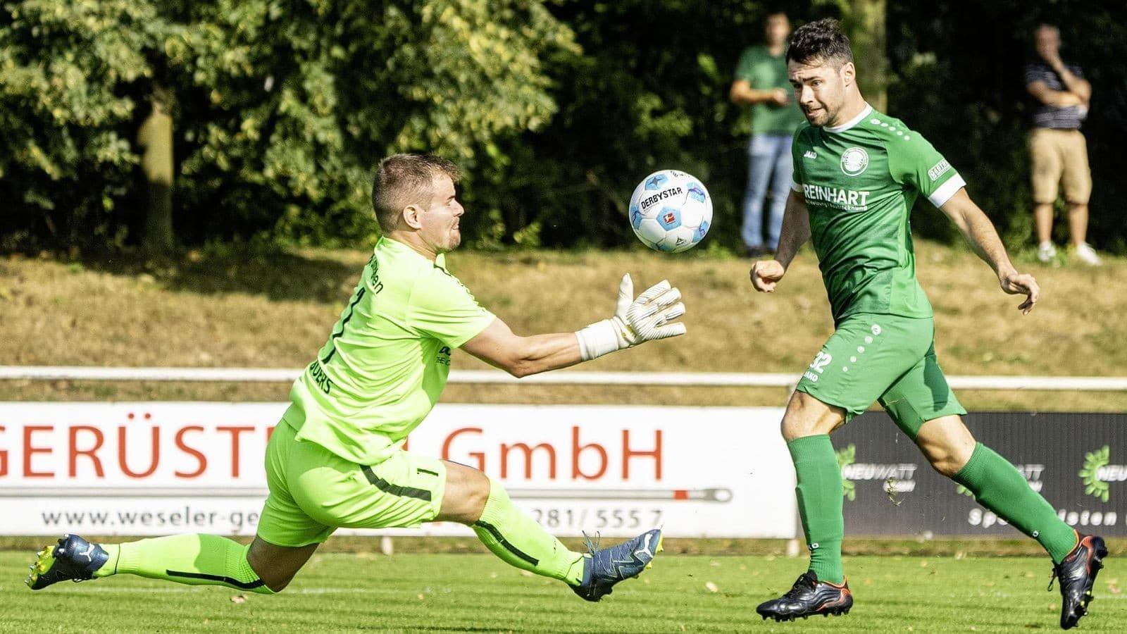 Goalkeeper attempting to catch the ball