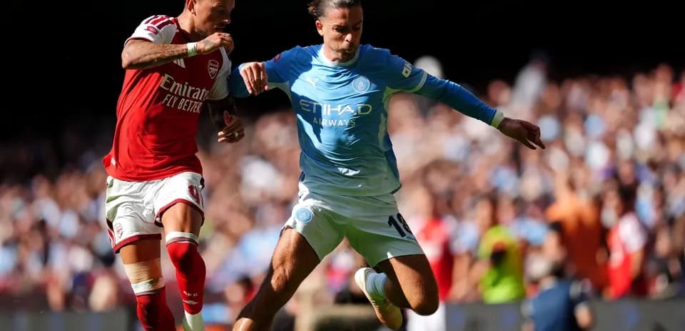 Two players contesting the ball during match action