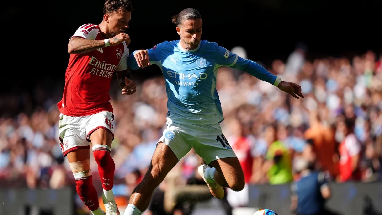 Two players contesting the ball during match action