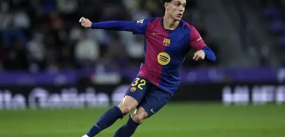 Barcelona player dribbling ball during match