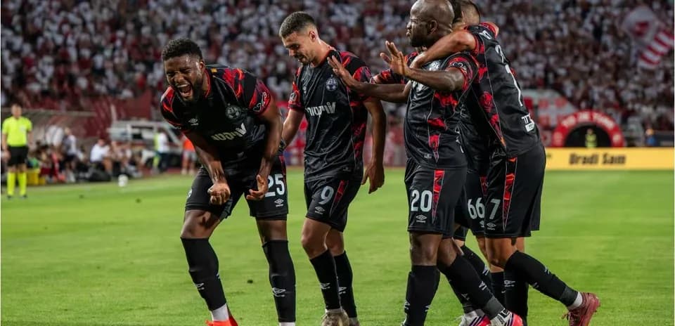 Players celebrating a goal during the match