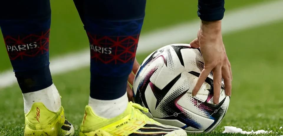 Player placing ball for a free kick
