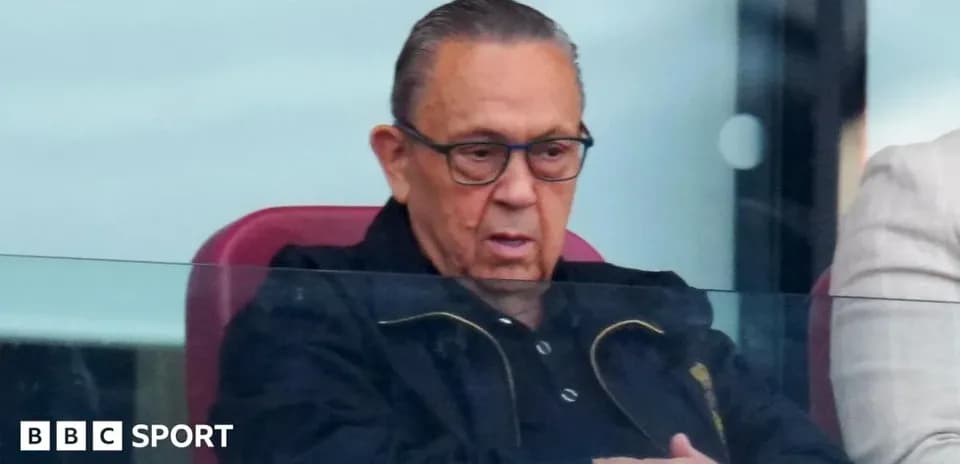Man observing from VIP box at sports event