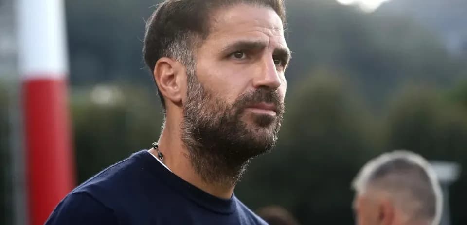 Man with beard observing training session