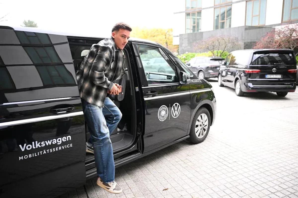 Player exiting Volkswagen vehicle at venue