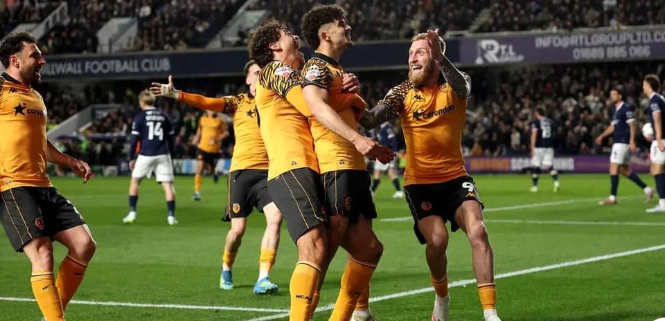 Wolverhampton players celebrating a goal on the pitch