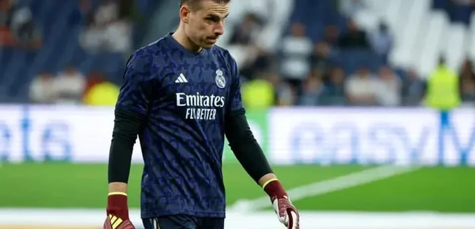 Goalkeeper walking off the field after match