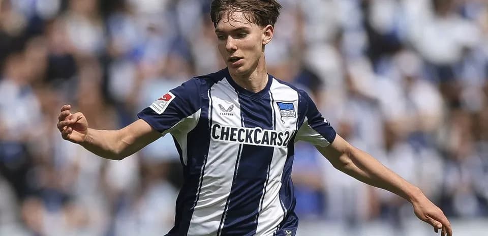 Player running with ball during match for Hertha BSC