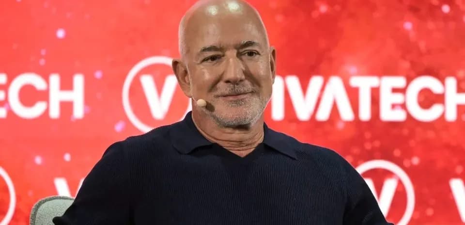 Speaker at VivaTech event with red backdrop