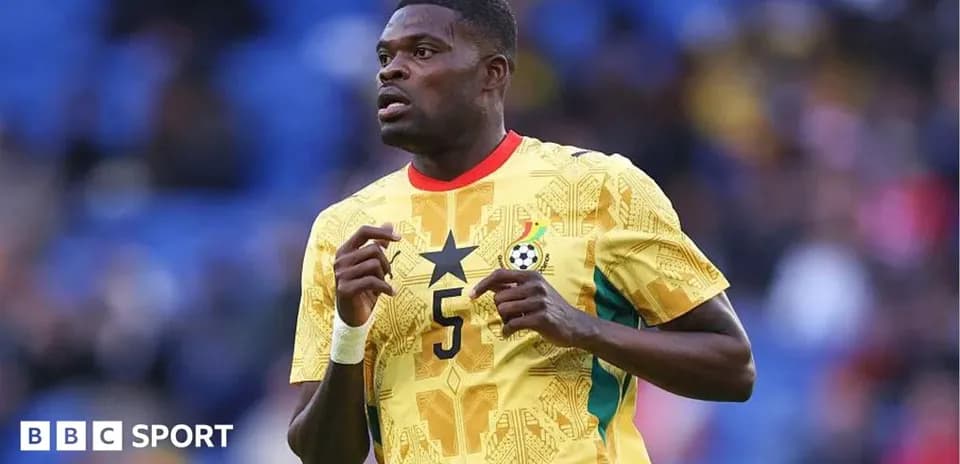 Ghana player wearing yellow jersey during match
