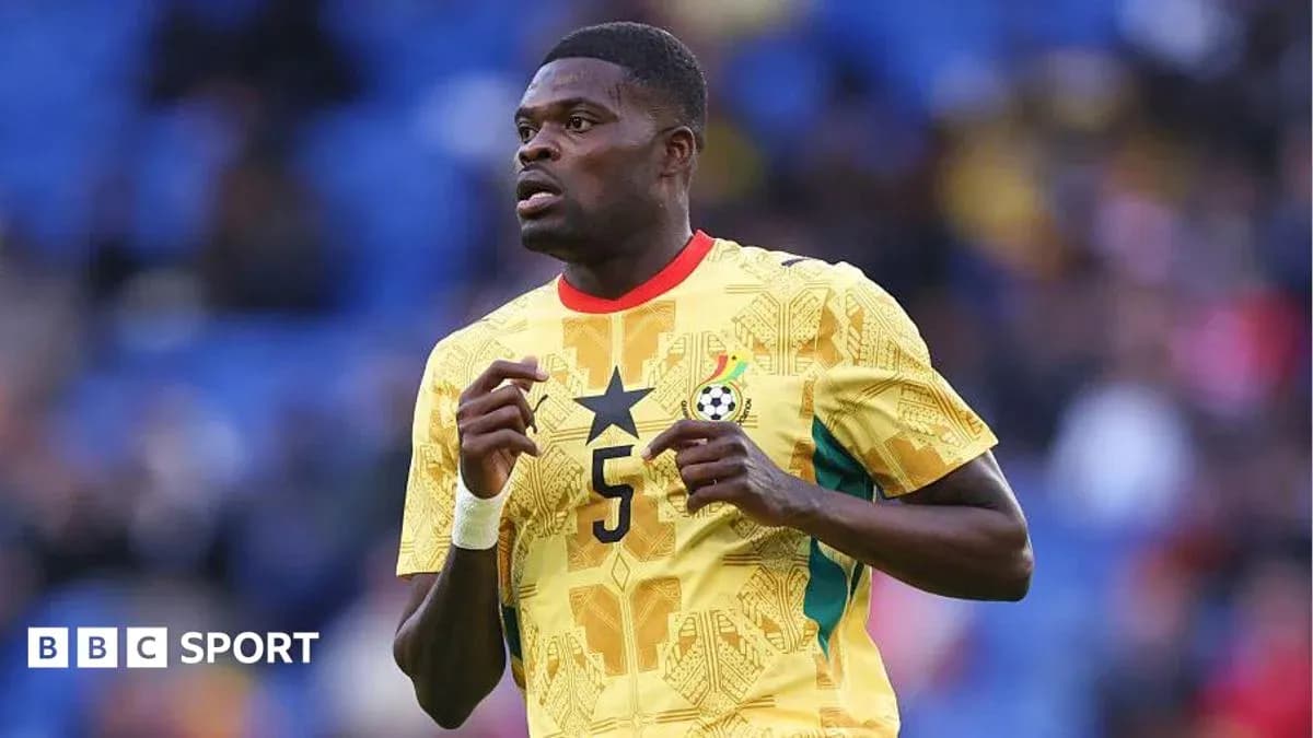Ghana player wearing yellow jersey during match