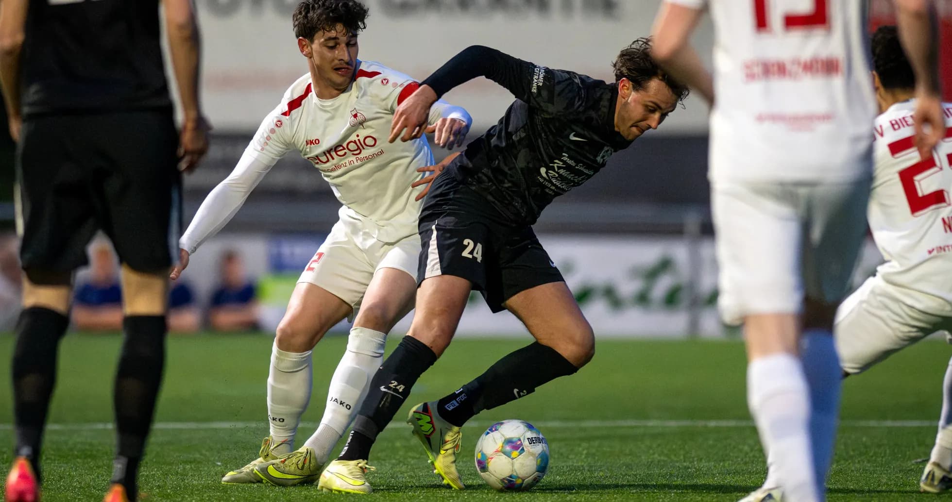 Players battling for the ball in Oberliga match
