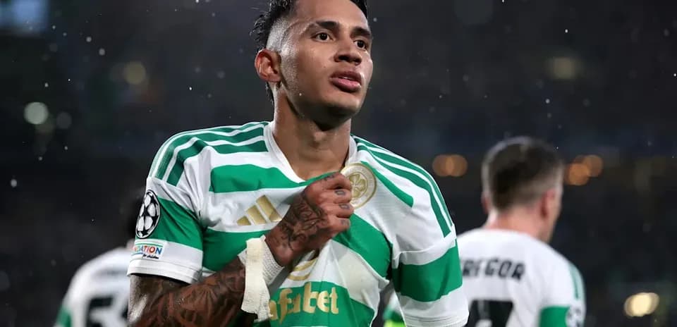 Player celebrating in Celtic jersey during match