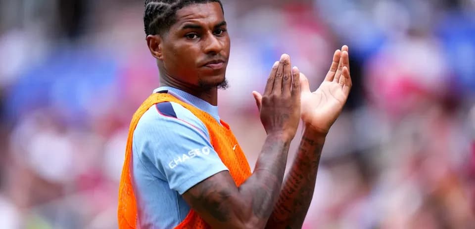 Player applauding while wearing training bib on field