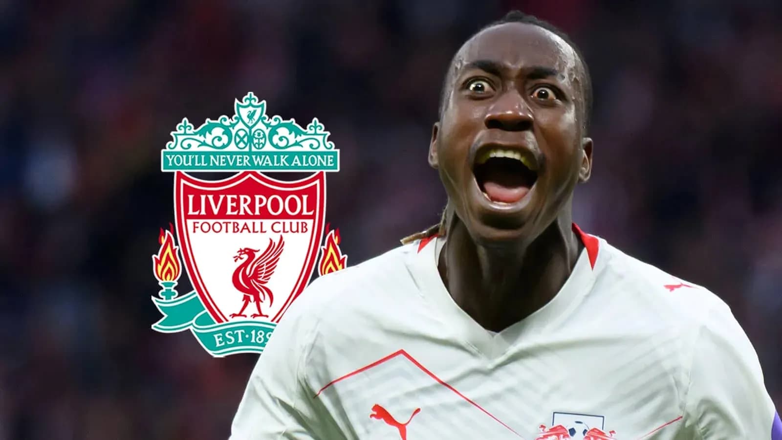 Player celebrating in front of Liverpool logo