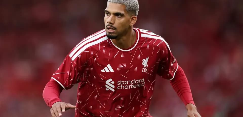 Player in Liverpool kit running on the pitch