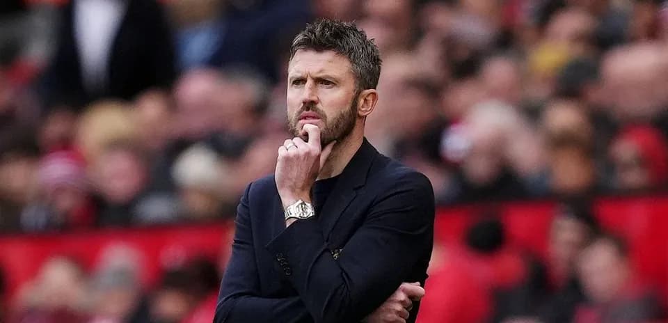 Manager pondering during a match at stadium