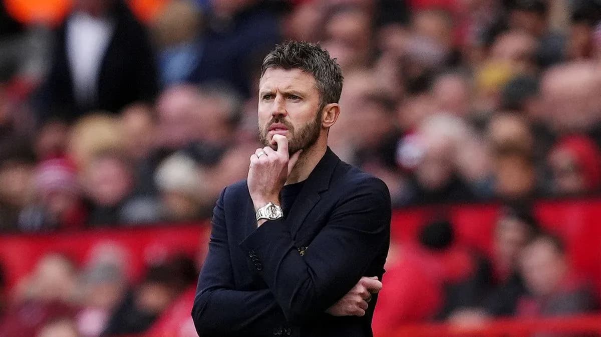Manager pondering during a match at stadium