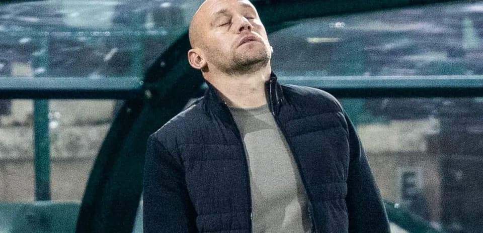 Coach looking on from the sidelines during match
